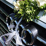 Audi grill with wedding ribbon and flowers Modern Wedding Cars Kent