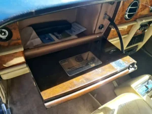 Rolls Royce 75th Anniversary plaque in glove compartment
